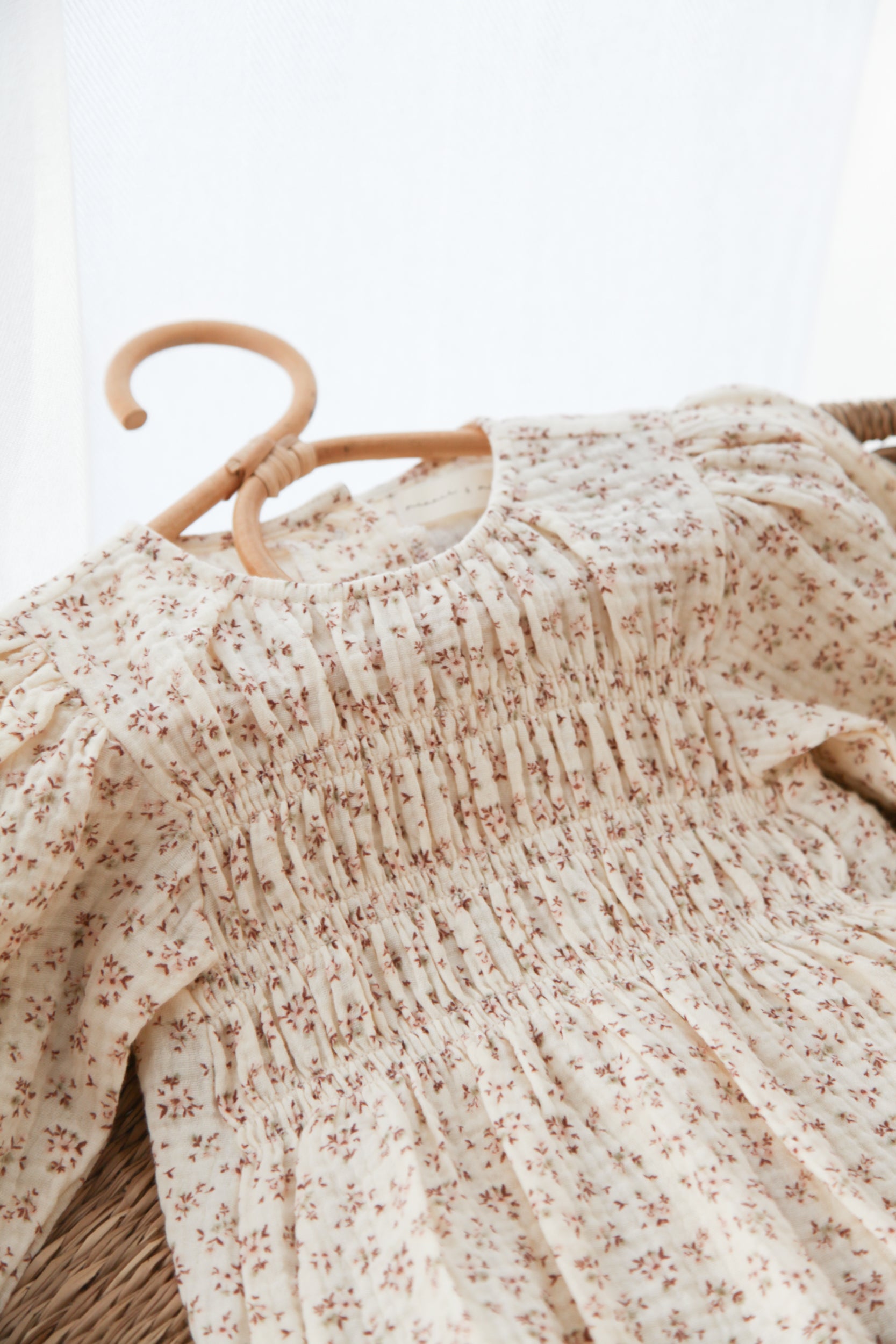 WHOLESALE Ditsy Floral/Buttermilk Muslin Smocked Long Sleeve Romper