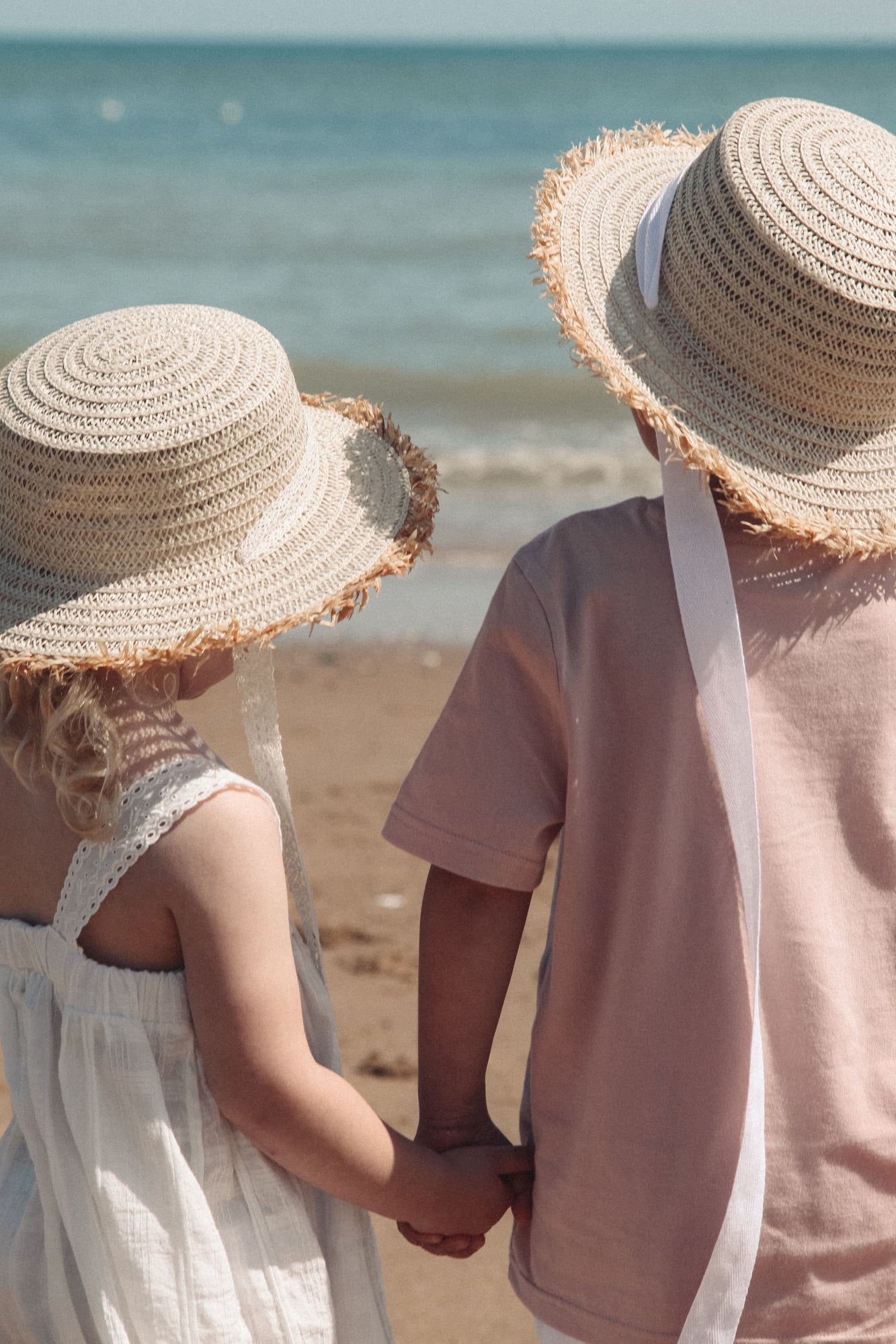 Straw Hat With White Cotton Ties