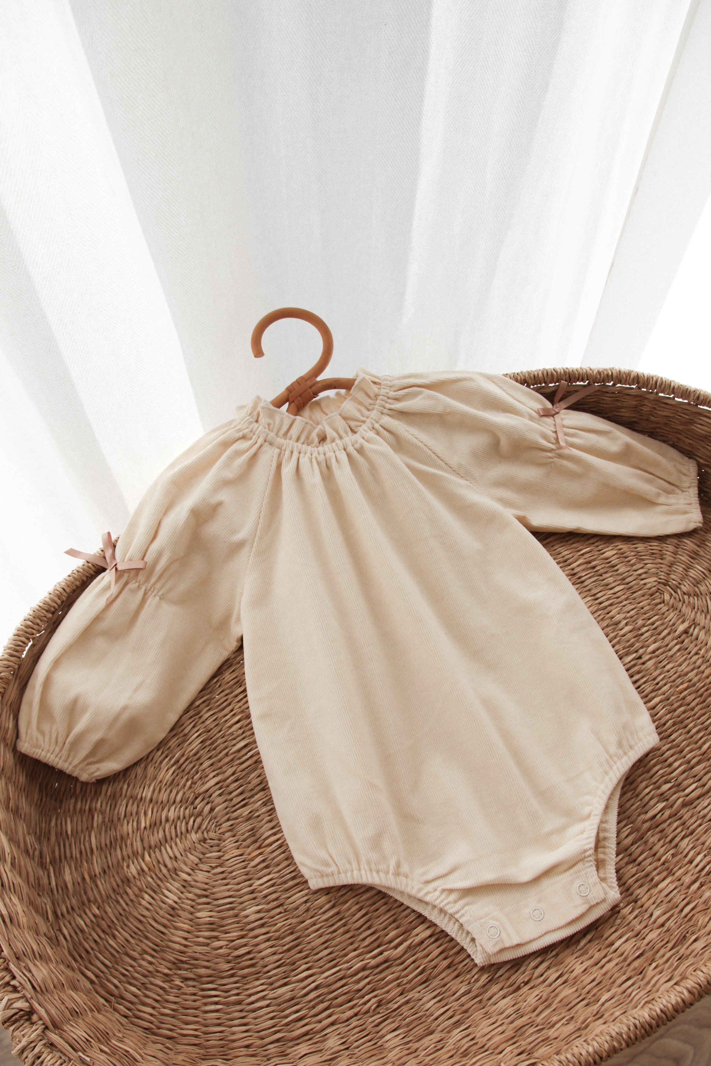 WHOLESALE Cream/Cord Bow Long Sleeve Romper