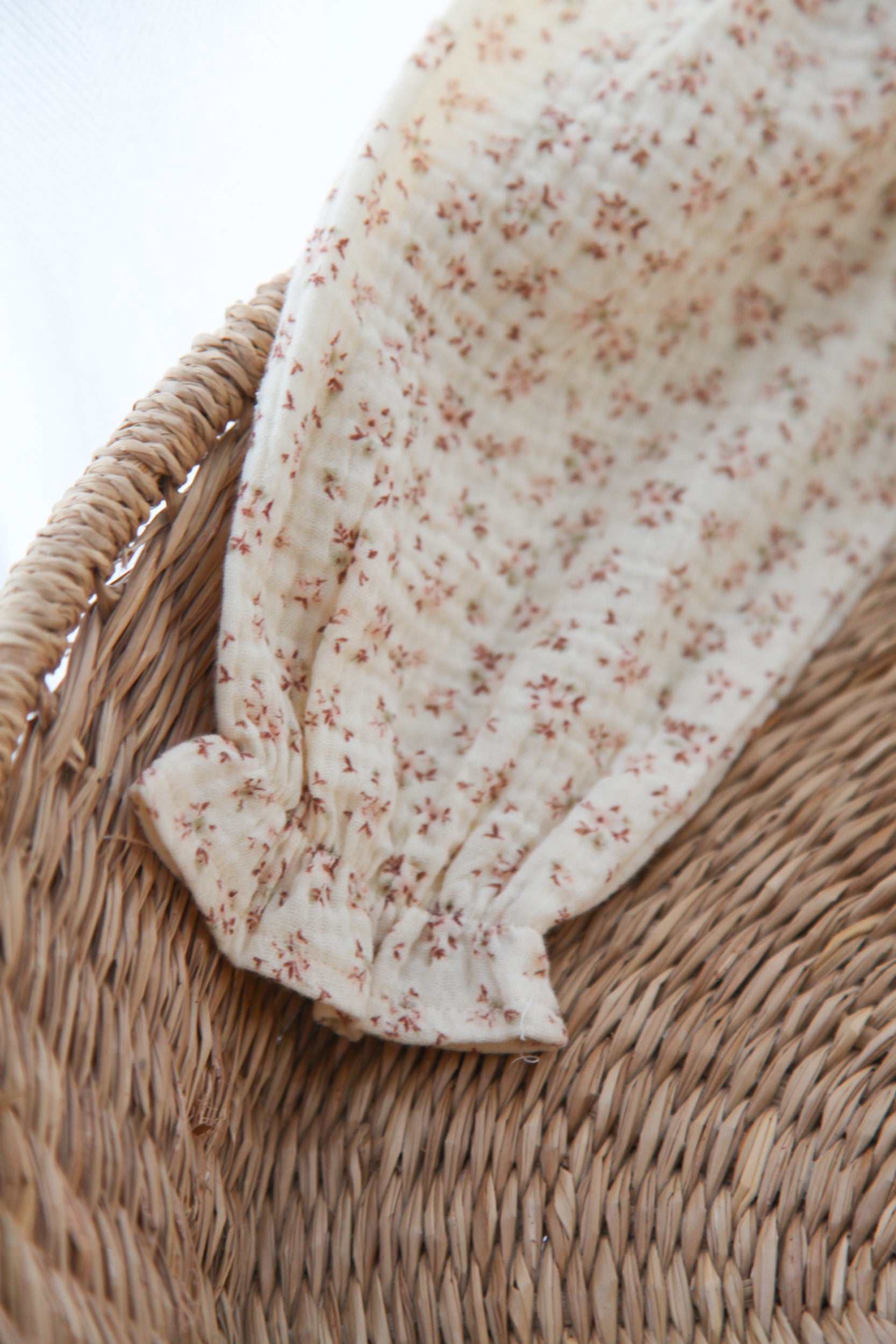 WHOLESALE Ditsy Floral/Buttermilk Muslin Smocked Long Sleeve Romper