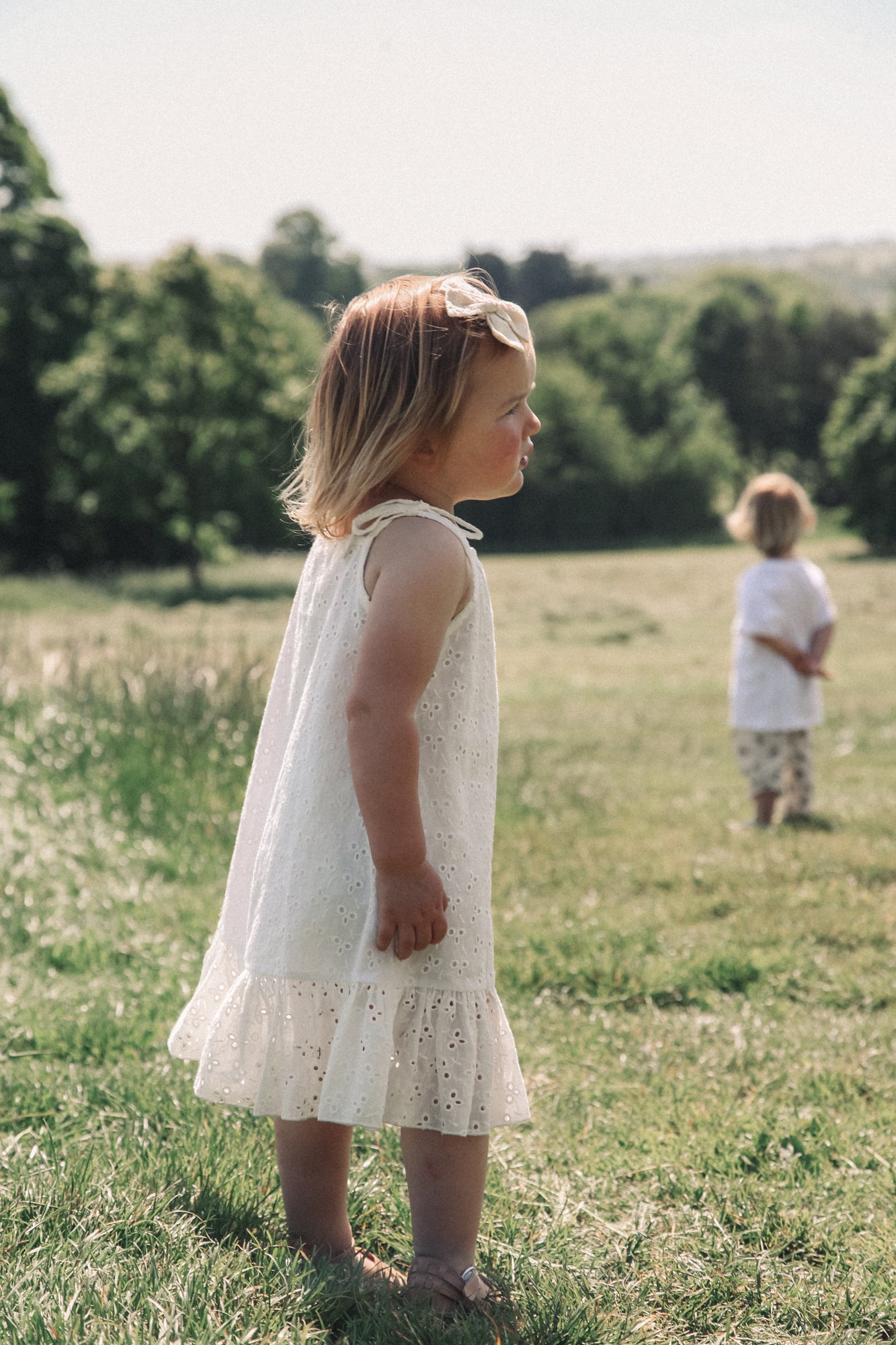 Minnie and Monty Tie Shoulder Frill Dress in White Broderie Anglaise