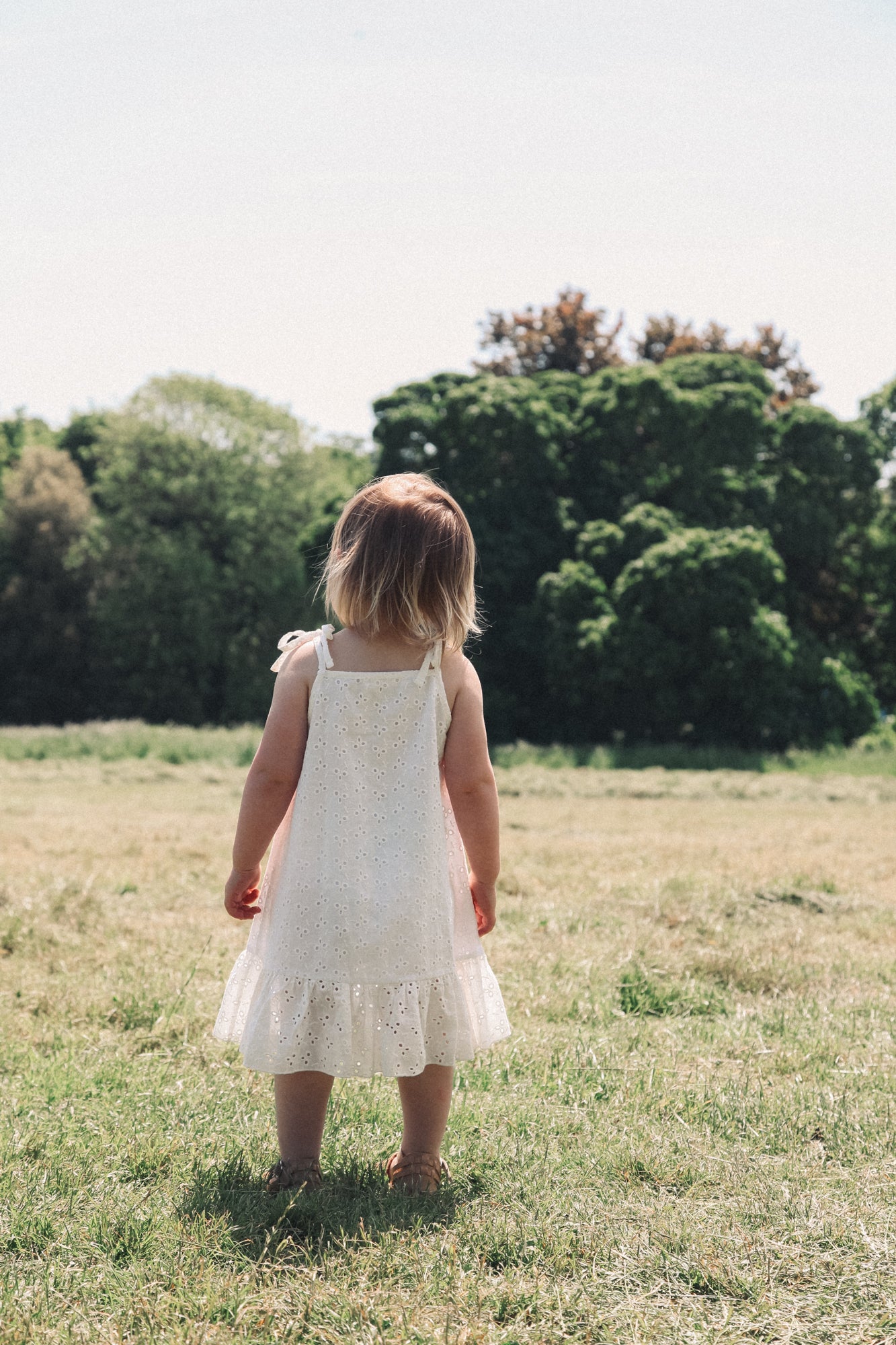 Minnie and Monty Tie Shoulder Frill Dress in White Broderie Anglaise